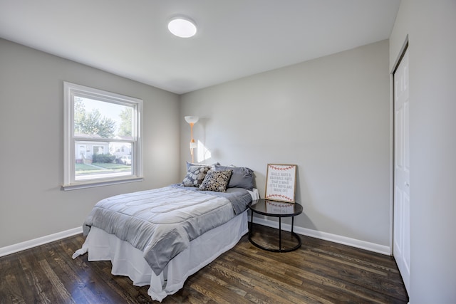 bedroom featuring dark hardwood / wood-style flooring