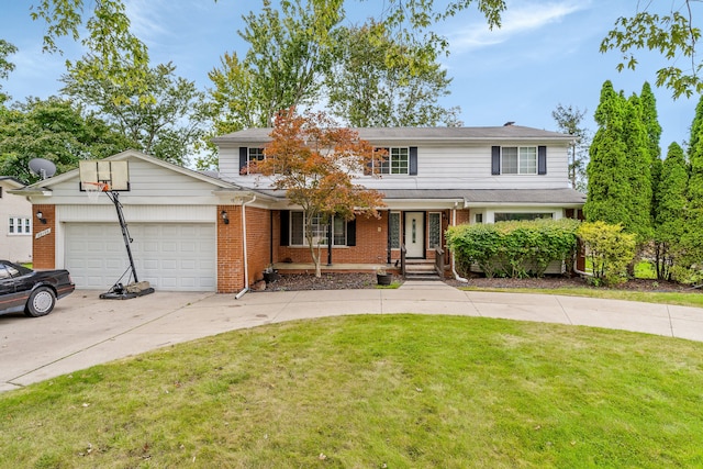 view of front facade with a front yard and a garage