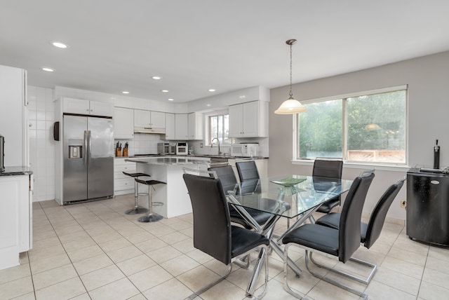 tiled dining area with sink