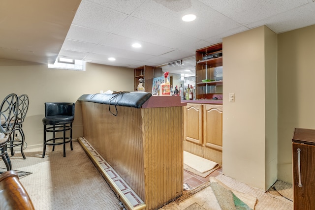 bar featuring a drop ceiling