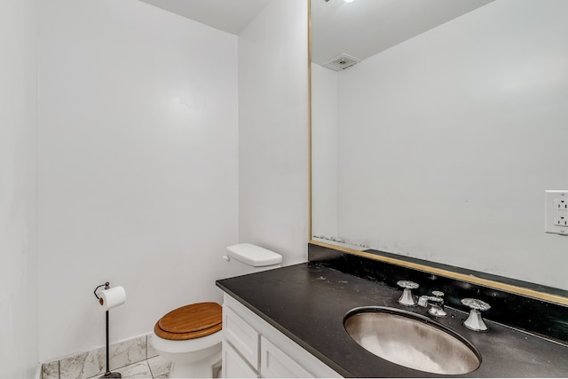 bathroom with vanity and toilet