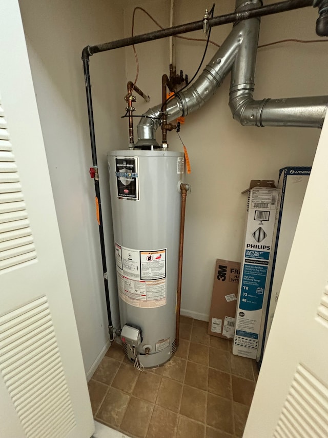 utility room featuring gas water heater