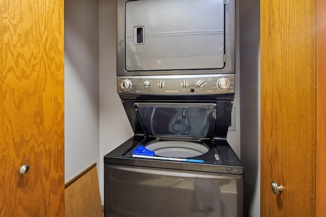 laundry room with stacked washer / dryer