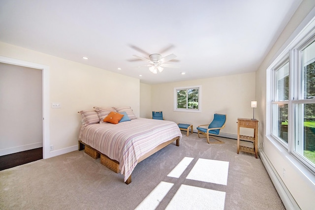 bedroom with a ceiling fan, baseboards, recessed lighting, light colored carpet, and baseboard heating