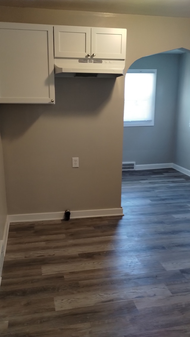 washroom with dark wood-type flooring