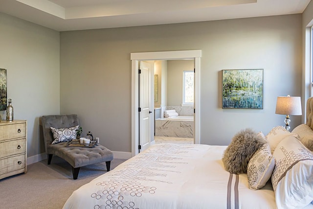 carpeted bedroom featuring ensuite bathroom