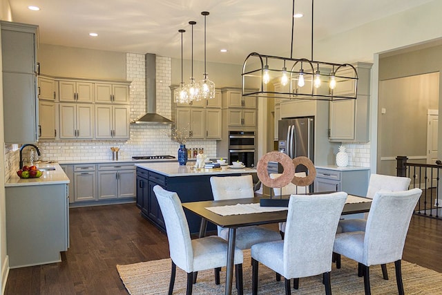 dining area featuring dark hardwood / wood-style floors and sink