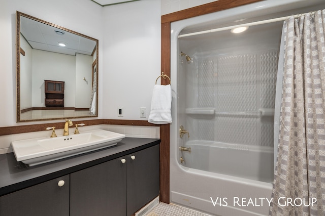 bathroom with tile patterned flooring, shower / tub combo, and vanity