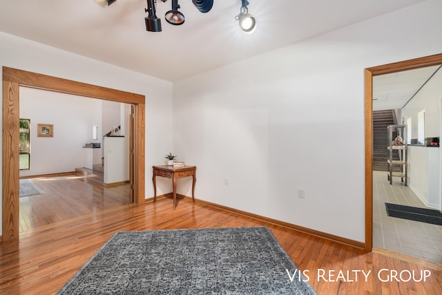 unfurnished room with hardwood / wood-style floors