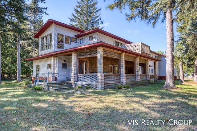 view of front of home featuring covered porch and a front yard