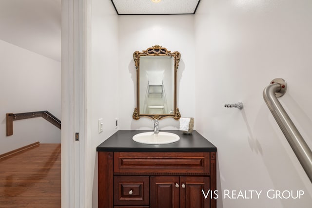 bathroom with vanity and wood-type flooring