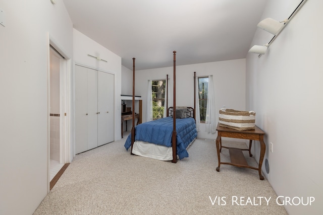 carpeted bedroom with a closet