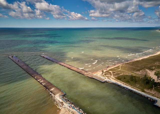 birds eye view of property featuring a water view and a view of the beach