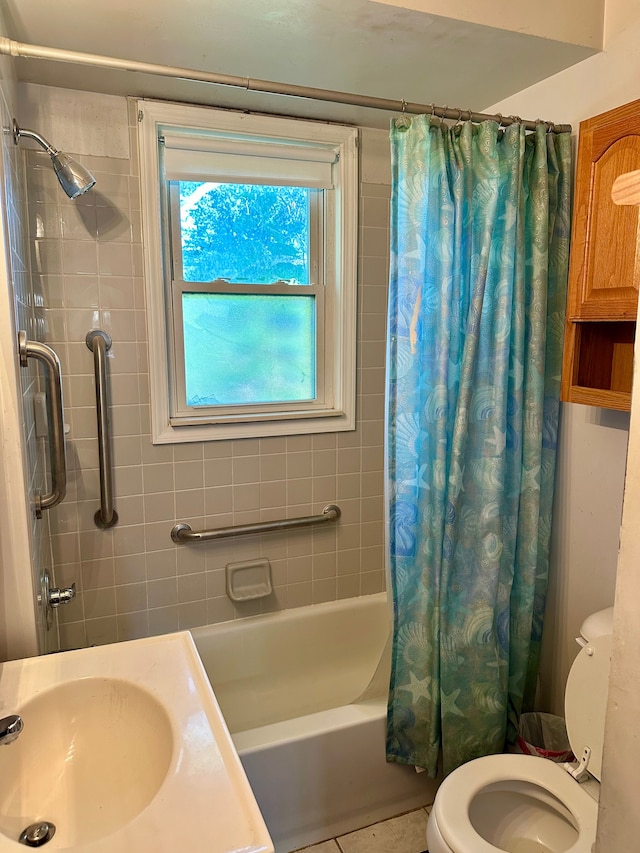 full bathroom featuring tile patterned flooring, toilet, sink, and shower / tub combo with curtain