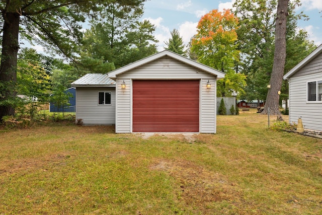 garage featuring a lawn