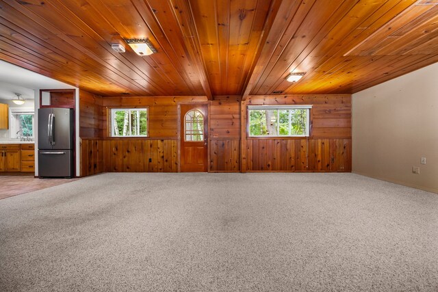 1758 W Nestel Rd, Prudenville, MI 48651 - unfurnished room featuring wooden walls, wooden ceiling, a sink, and light colored carpet