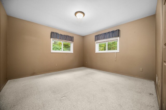 1758 W Nestel Rd, Prudenville, MI 48651 - carpeted empty room featuring baseboards