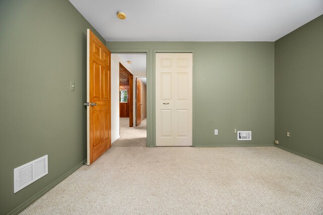 1758 W Nestel Rd, Prudenville, MI 48651 - empty room with light colored carpet, a smoke detector, and baseboards