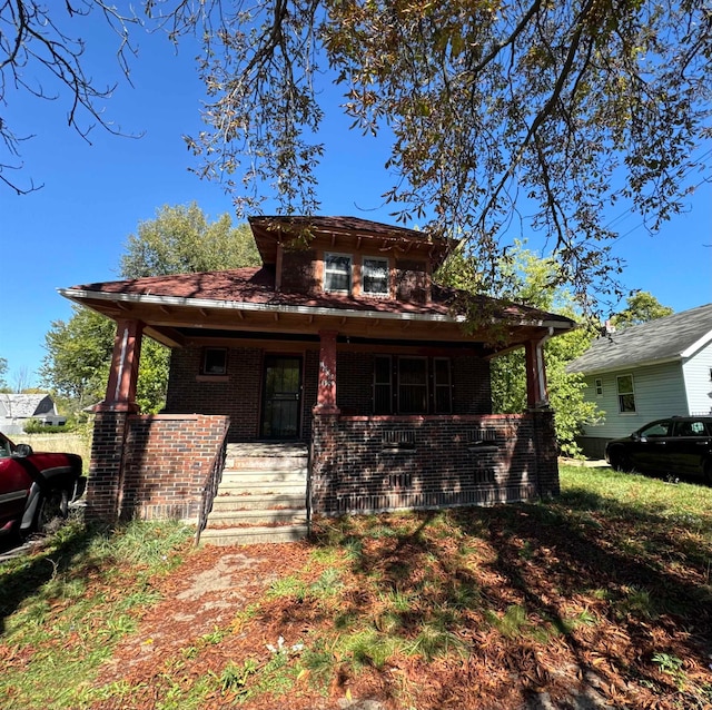 view of front of property featuring covered porch