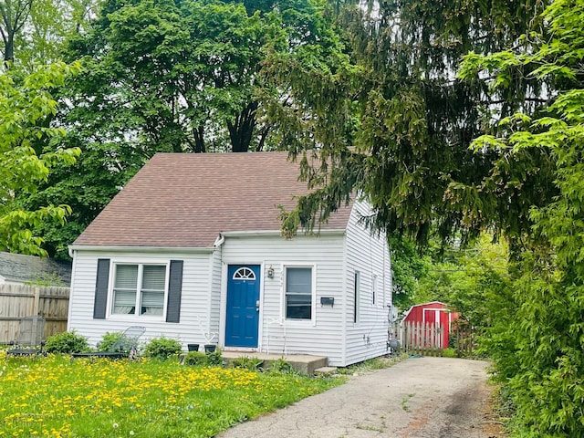 view of front of house with a shed