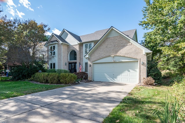 view of front facade featuring a front yard and a garage