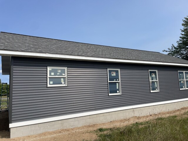 6193 S Pere Marquette Hwy, Pentwater, MI 49449 - view of side of property featuring roof with shingles