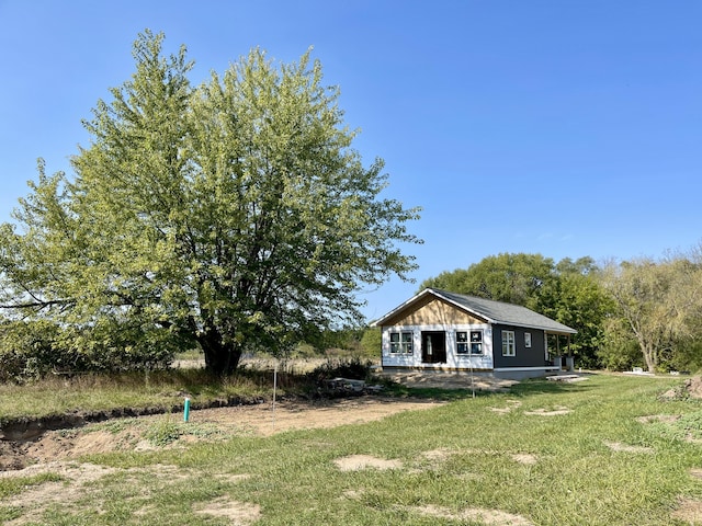 6193 S Pere Marquette Hwy, Pentwater, MI 49449 - view of front of home featuring a front lawn
