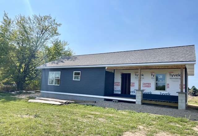 6193 S Pere Marquette Hwy, Pentwater, MI 49449 - view of front facade with a front lawn and roof with shingles