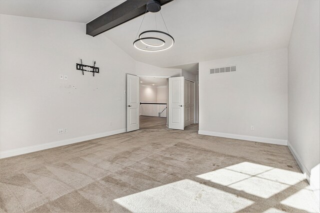 unfurnished bedroom with light carpet, vaulted ceiling with beams, and a notable chandelier