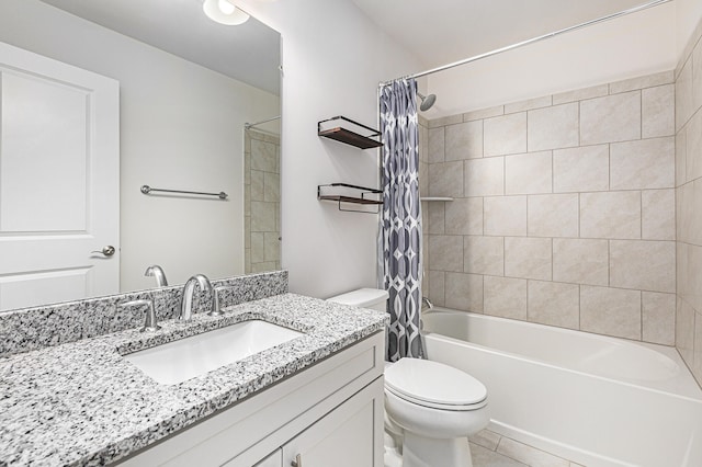 full bathroom featuring tile patterned flooring, shower / bath combo with shower curtain, vanity, and toilet