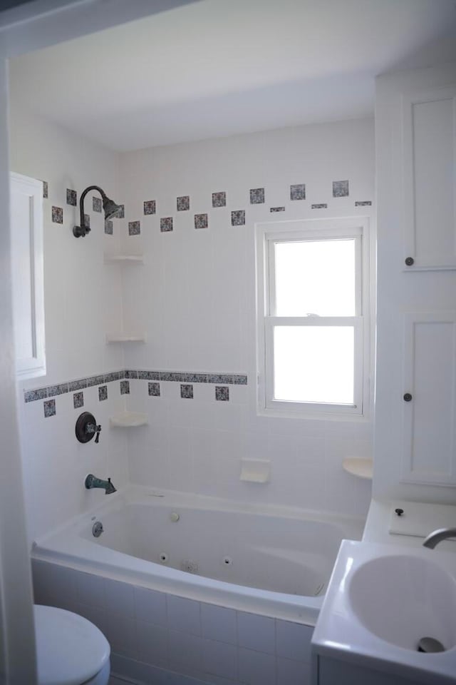 bathroom featuring sink and toilet