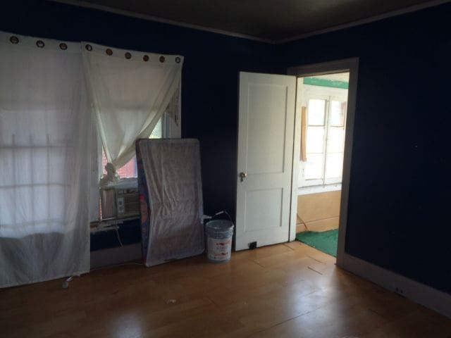 unfurnished bedroom featuring hardwood / wood-style floors