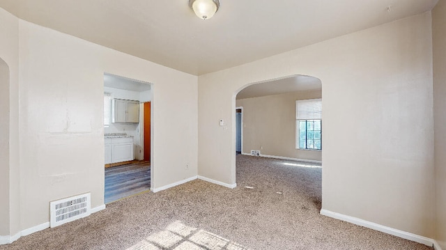 unfurnished room featuring carpet floors