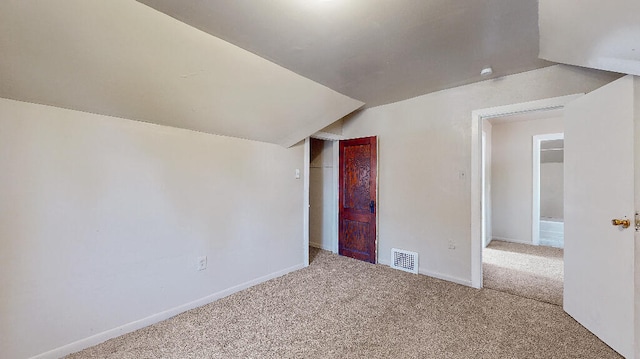 bonus room featuring carpet and lofted ceiling