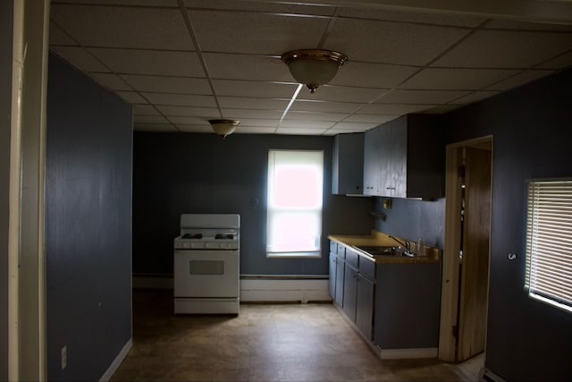 kitchen featuring baseboard heating, white range with gas cooktop, sink, and a drop ceiling