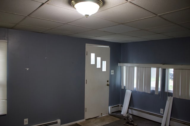 entryway with a paneled ceiling and a baseboard radiator