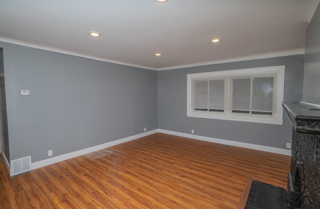 unfurnished living room with hardwood / wood-style flooring