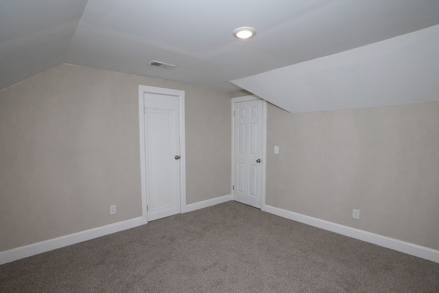 bonus room featuring lofted ceiling and carpet floors