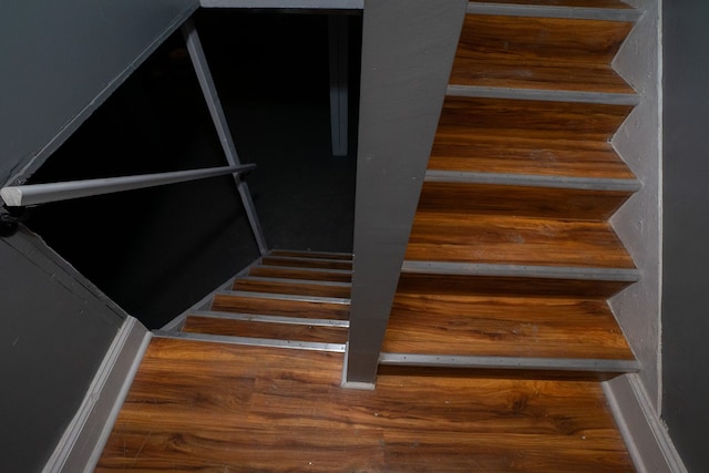 staircase featuring hardwood / wood-style floors