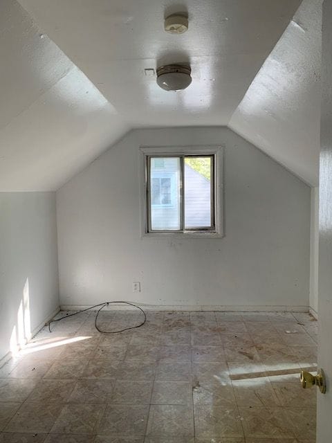 bonus room with vaulted ceiling