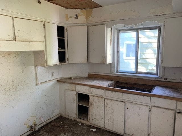 kitchen featuring white cabinets