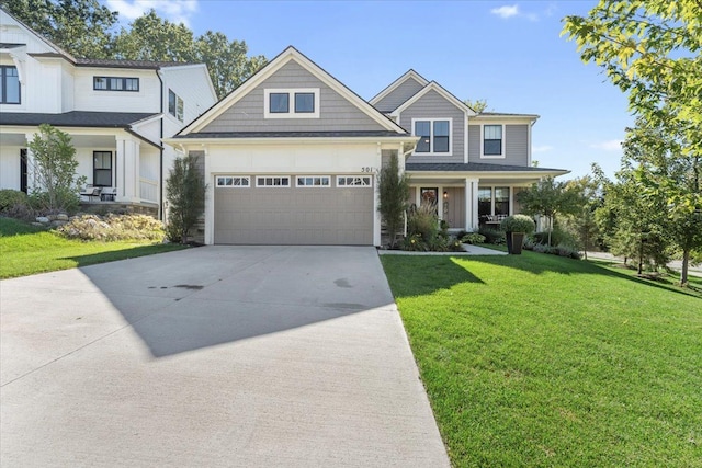 craftsman-style home with a front yard and a garage