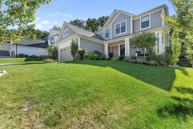 view of front facade featuring a garage and a front yard