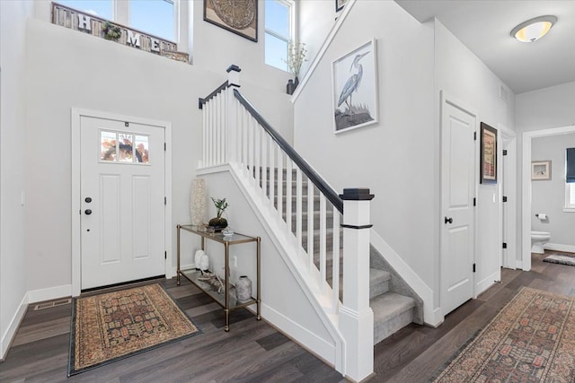 foyer entrance with dark wood-type flooring