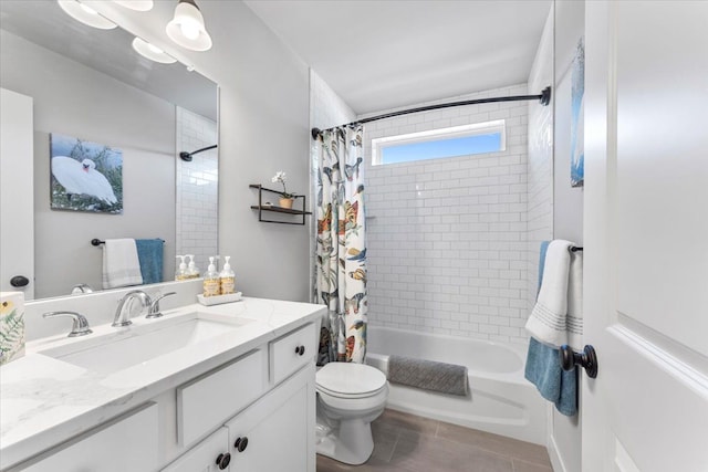 full bathroom featuring tile patterned floors, vanity, toilet, and shower / bath combo