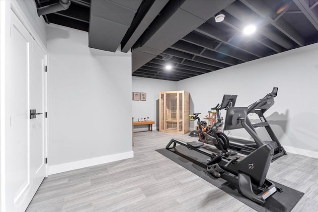 exercise area with light wood-type flooring