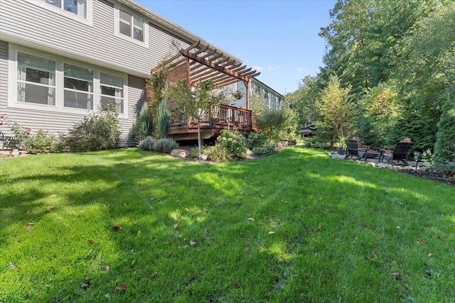 view of yard featuring a deck and a pergola