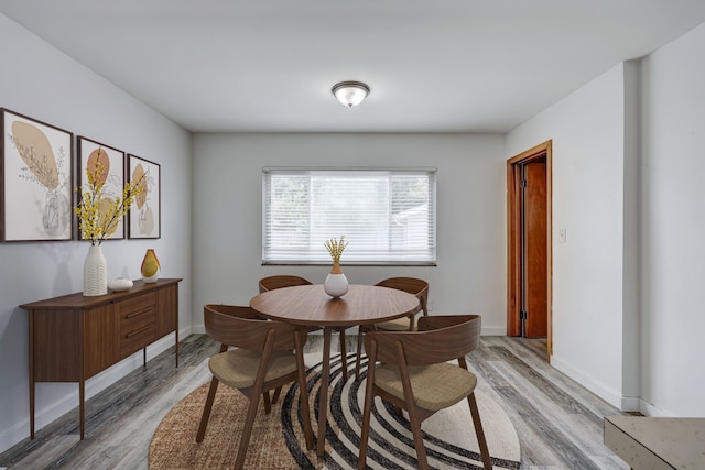 dining space featuring hardwood / wood-style floors