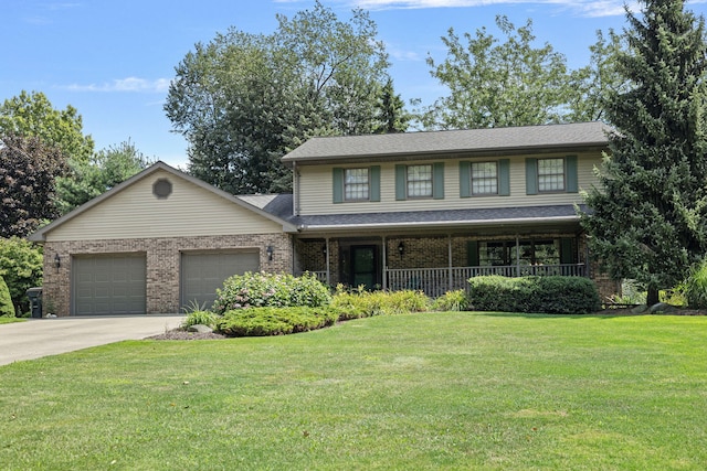 view of front facade with a porch, a front yard, and a garage