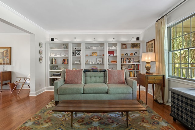 living room with hardwood / wood-style floors and ornamental molding